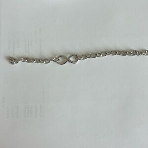 Sterling silver infinity bracelet, 7” long. Almost new.